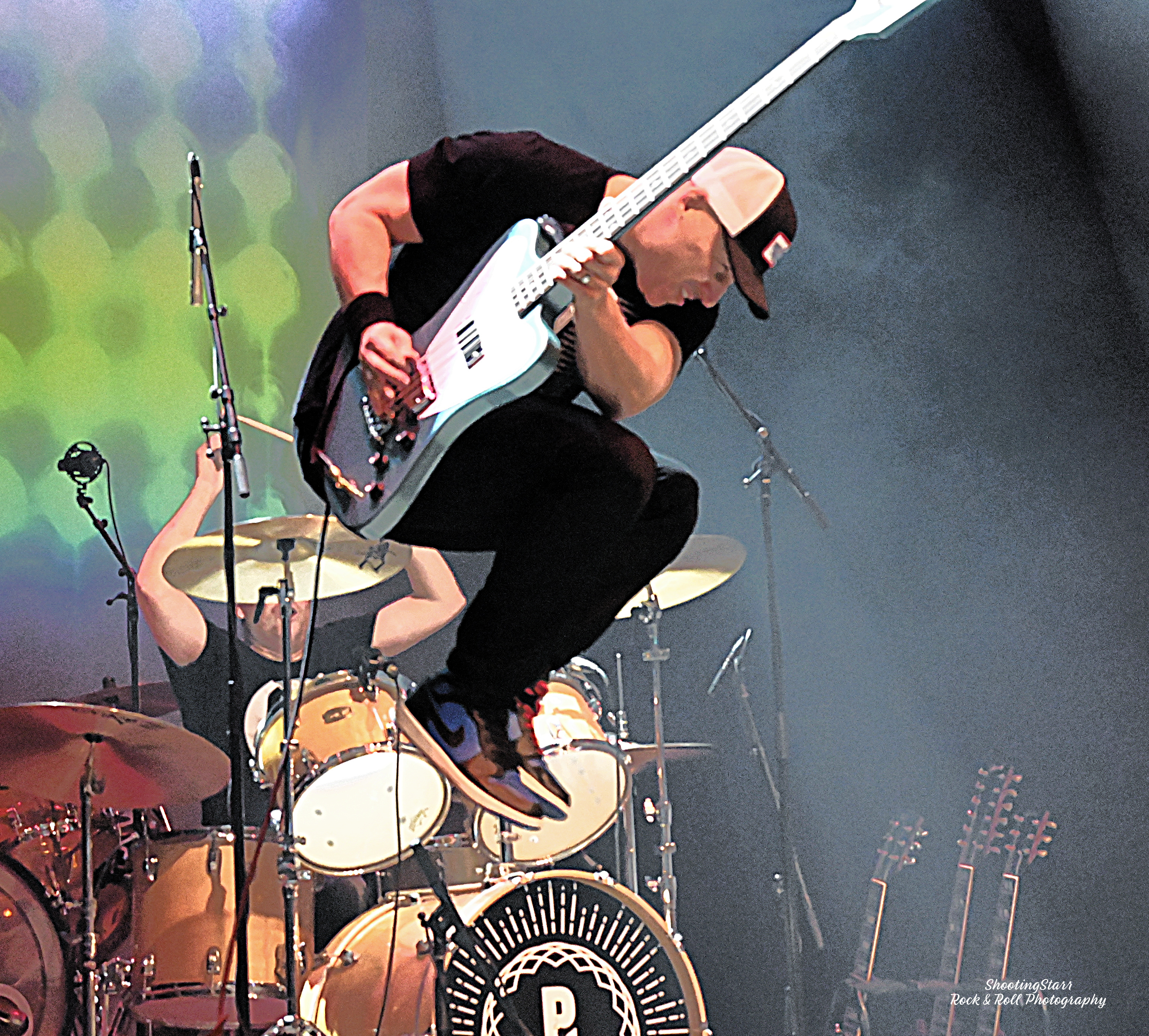 Guitarist jumping mid-air